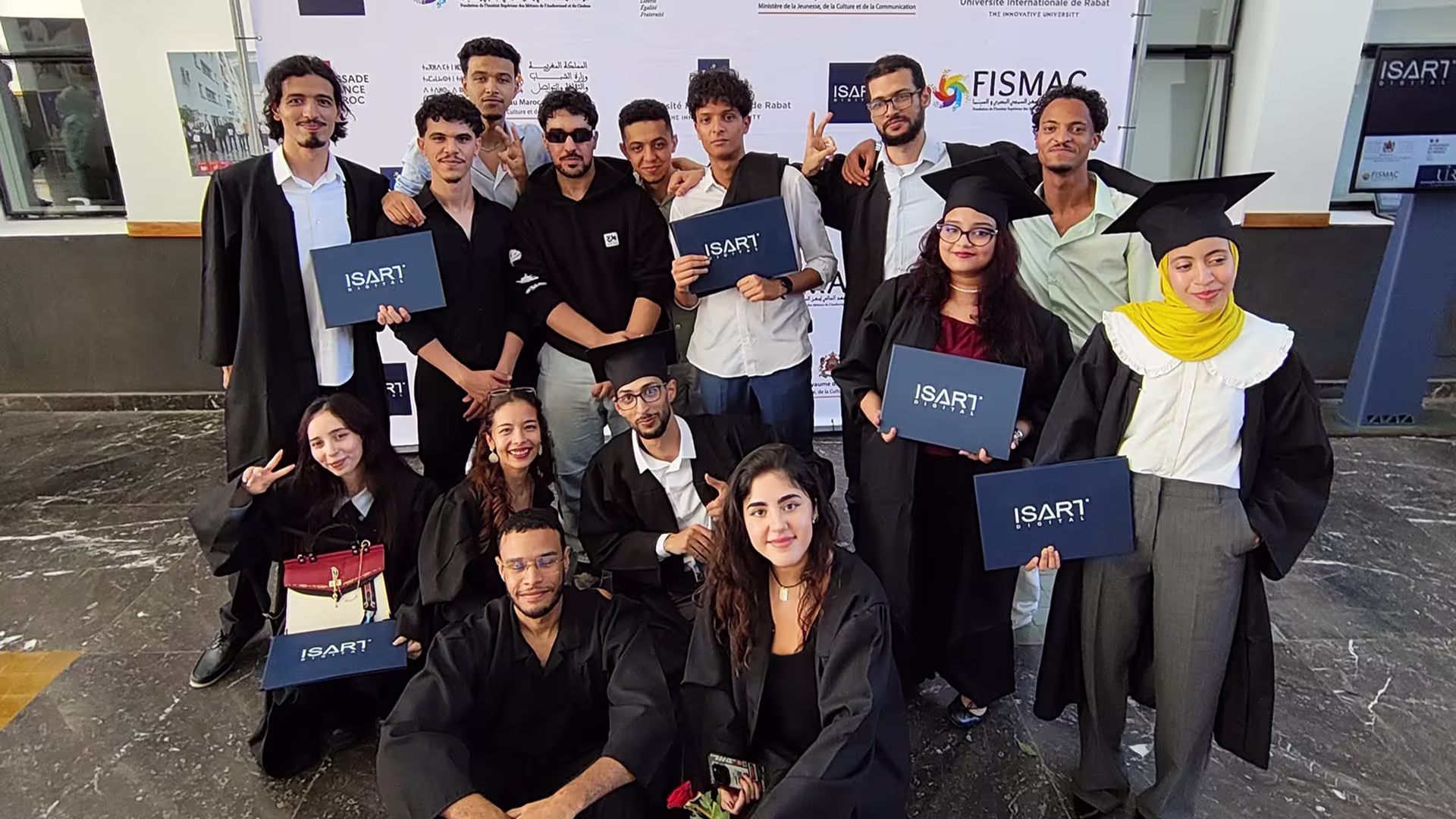 Video Game Creator graduates holding their program folders