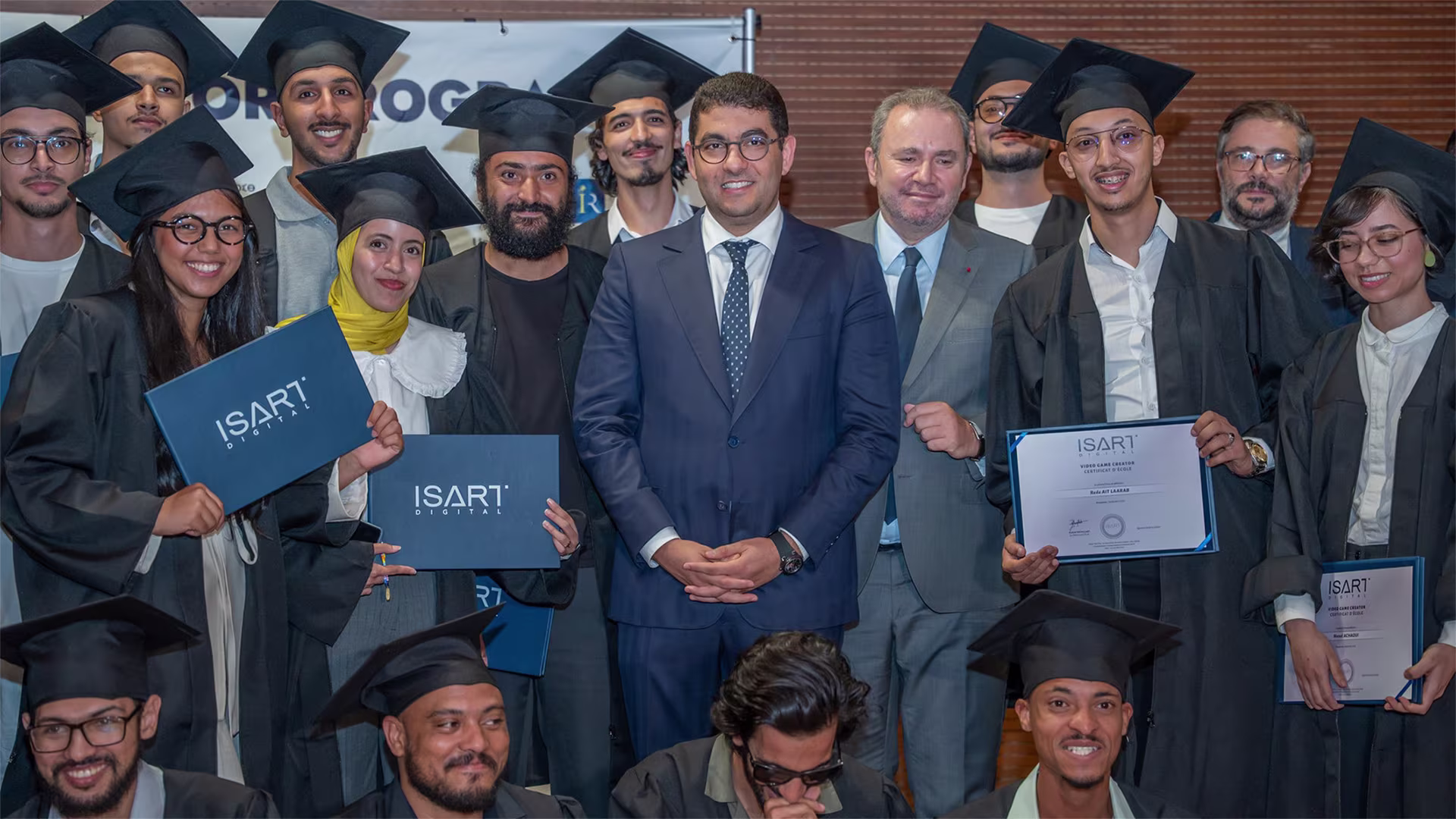Graduates celebrating with program officials and partners